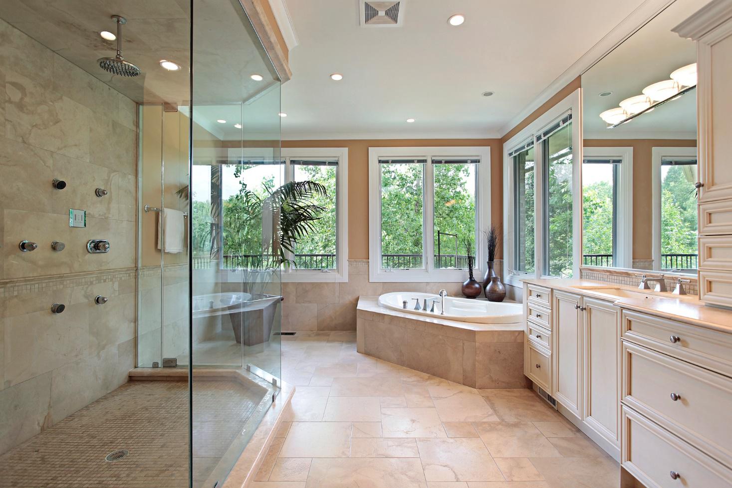 A large bathroom with custom shower glass